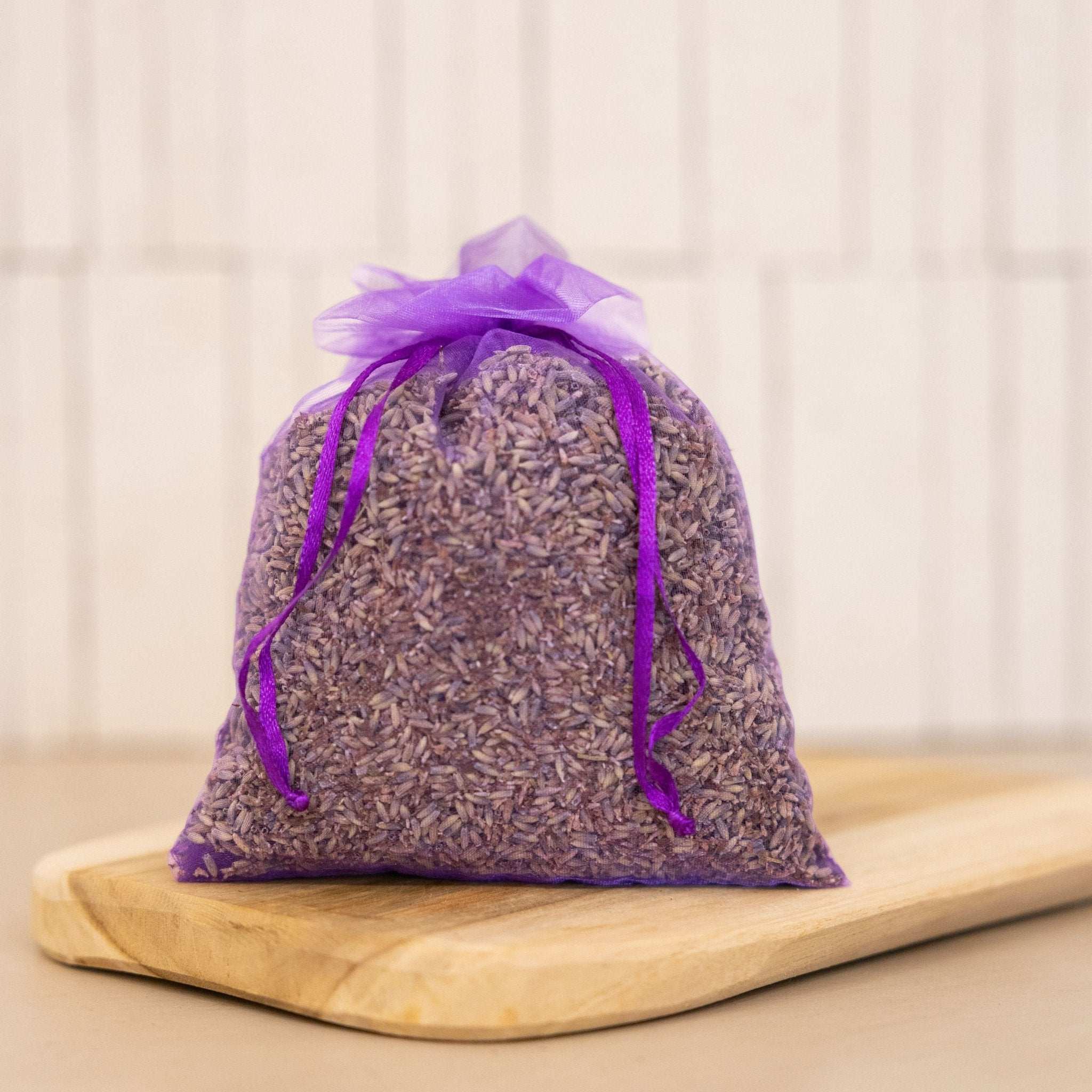 An organic dried lavender pouch from Céline en Provence, used for freshening up clothes and spaces with a calming scent.