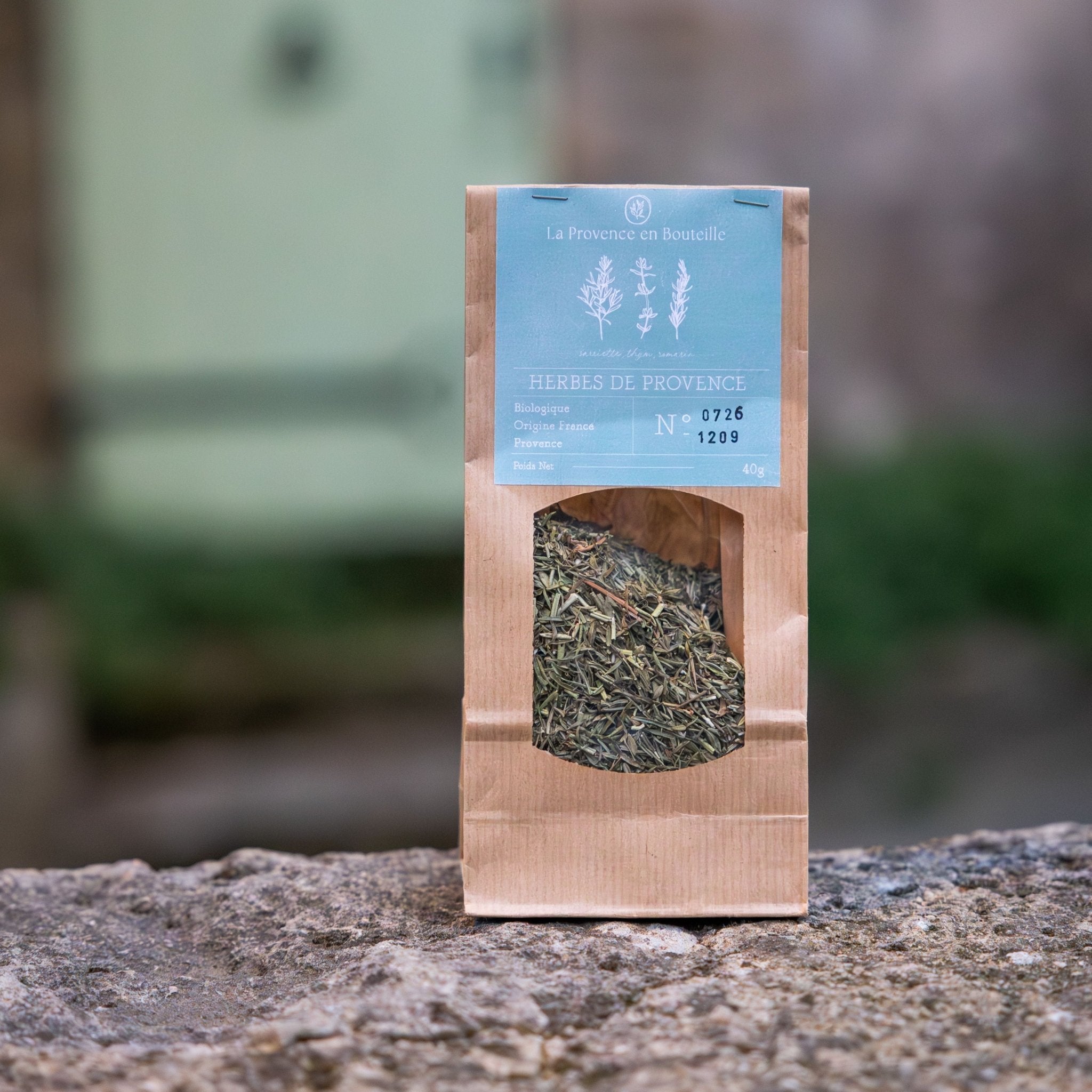 A jar of organic Provence herbs, a blend of thyme, rosemary, and savoury, for adding authentic Provençal flavour to cooking.