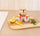 Artisanal wooden salt spoon paired with Fleur de Sel de Camargue trio jars and rosemary, Provençal gourmet gift