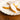 Calissons d'Aix by Le Roy René stacked on a white plate, almond and melon confectionery from Provence