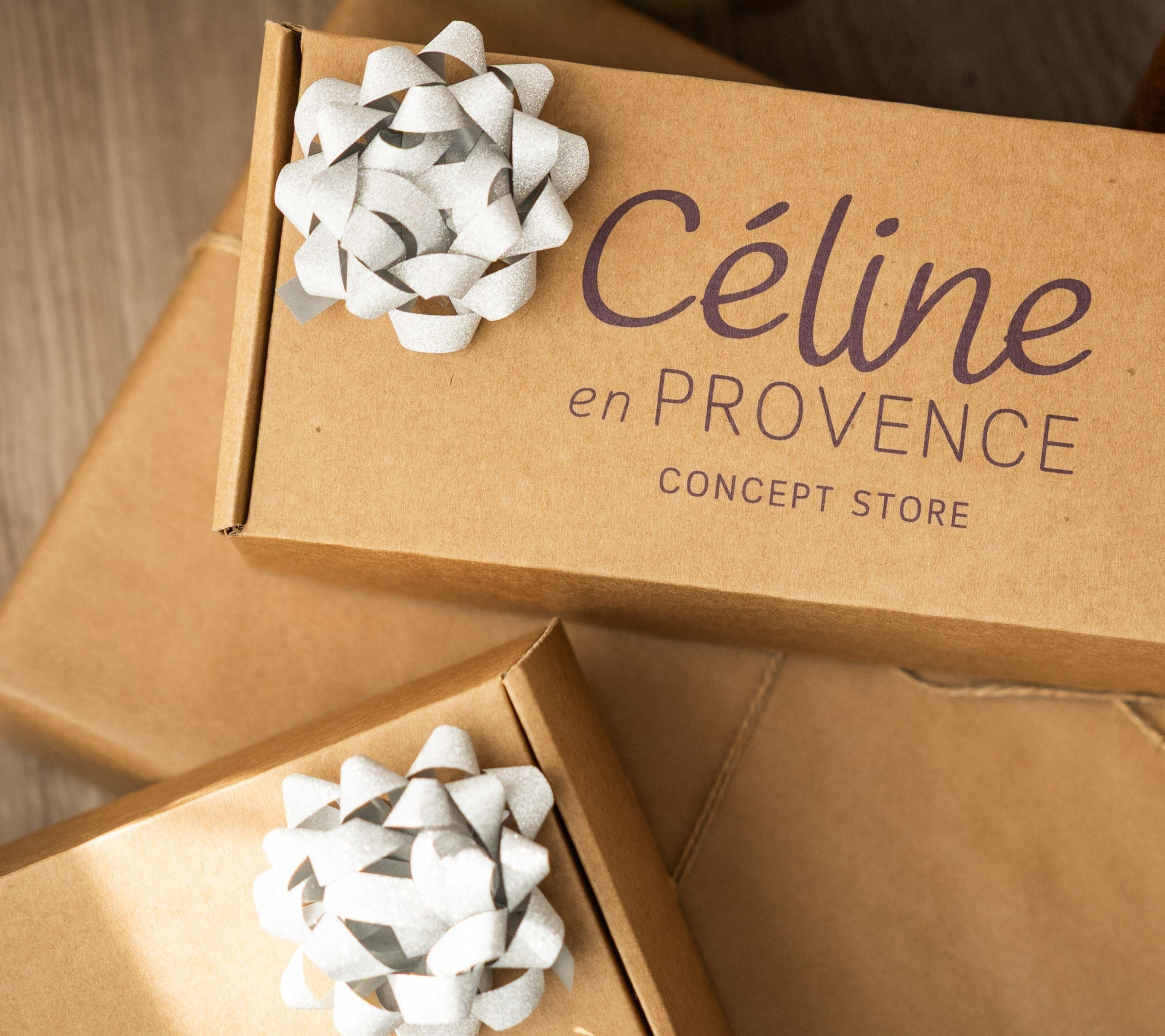 Custom kraft corporate gift boxes with Céline en Provence logo and silver bows, showcasing our B2B co-branding and tailored selection services.