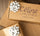 Custom kraft corporate gift boxes with Céline en Provence logo and silver bows, showcasing our B2B co-branding and tailored selection services.