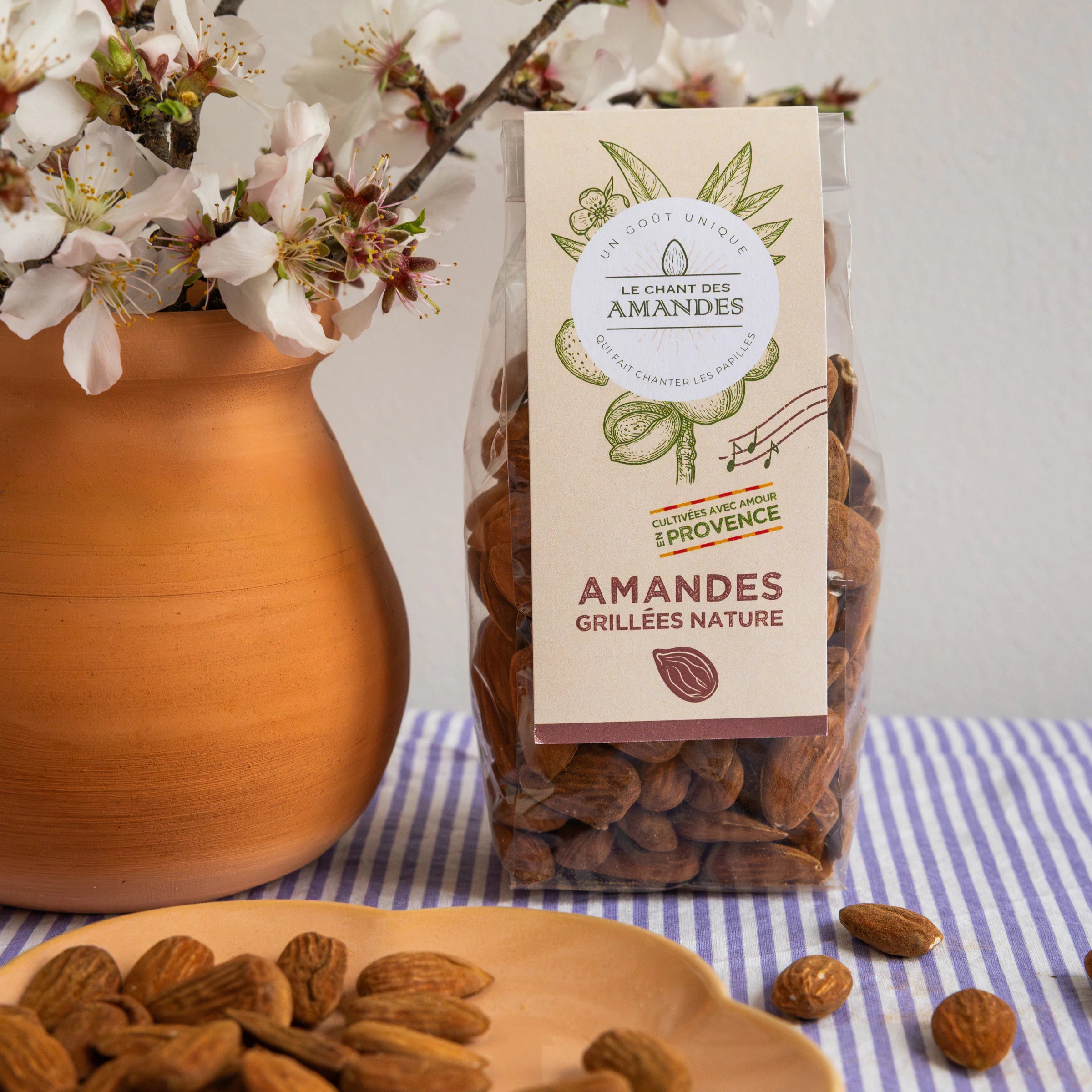 Le Chant des Amandes grilled almonds bag from Provence with almond blossom and terracotta vase