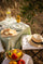 Summer Collection banner, Provençal table set outdoors under olive trees with olive oil and seasonal produce, summer in Provence