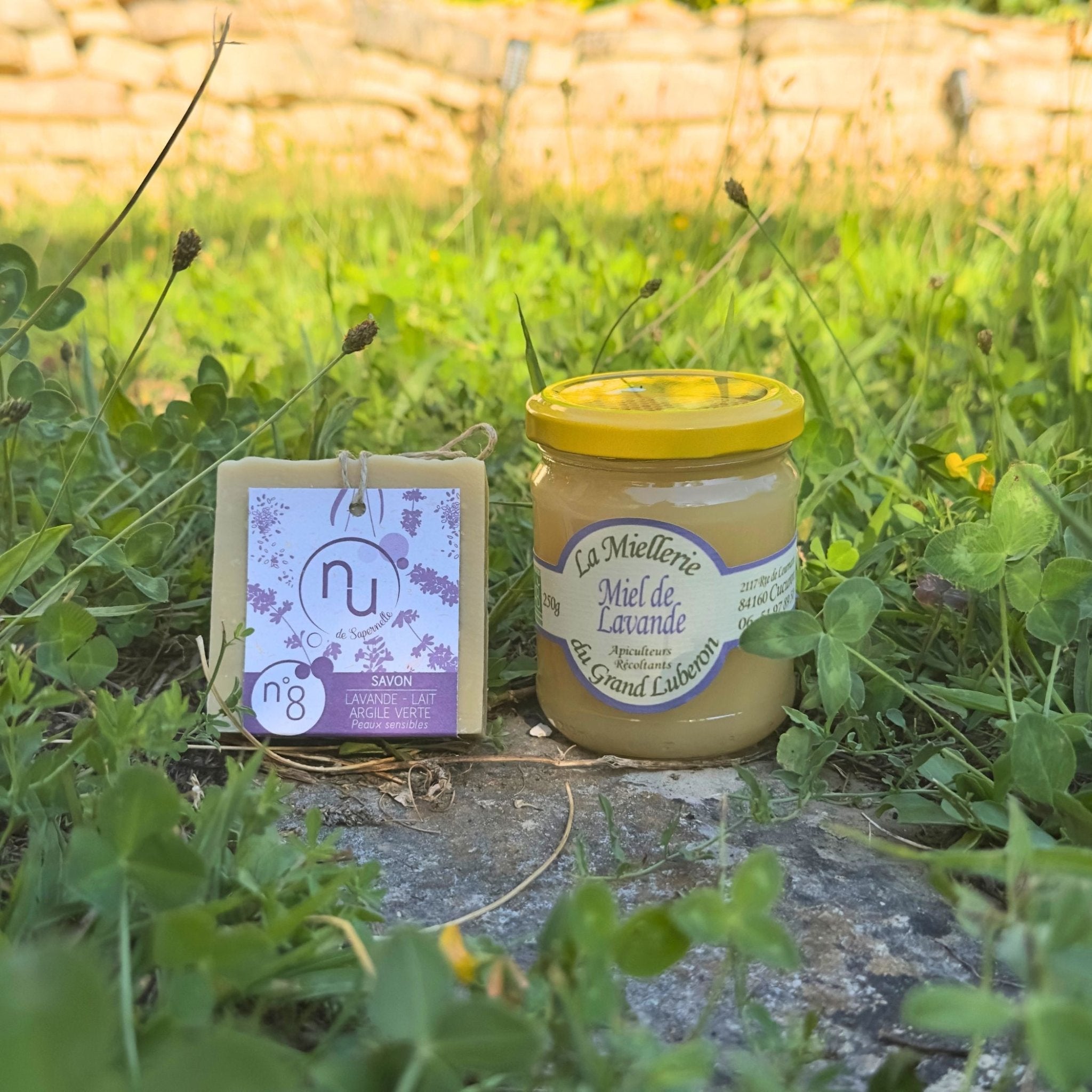 A gift box of the Lavender Bliss Duo from Céline en Provence, featuring a jar of organic lavender honey and a block of soothing artisanal lavender soap.