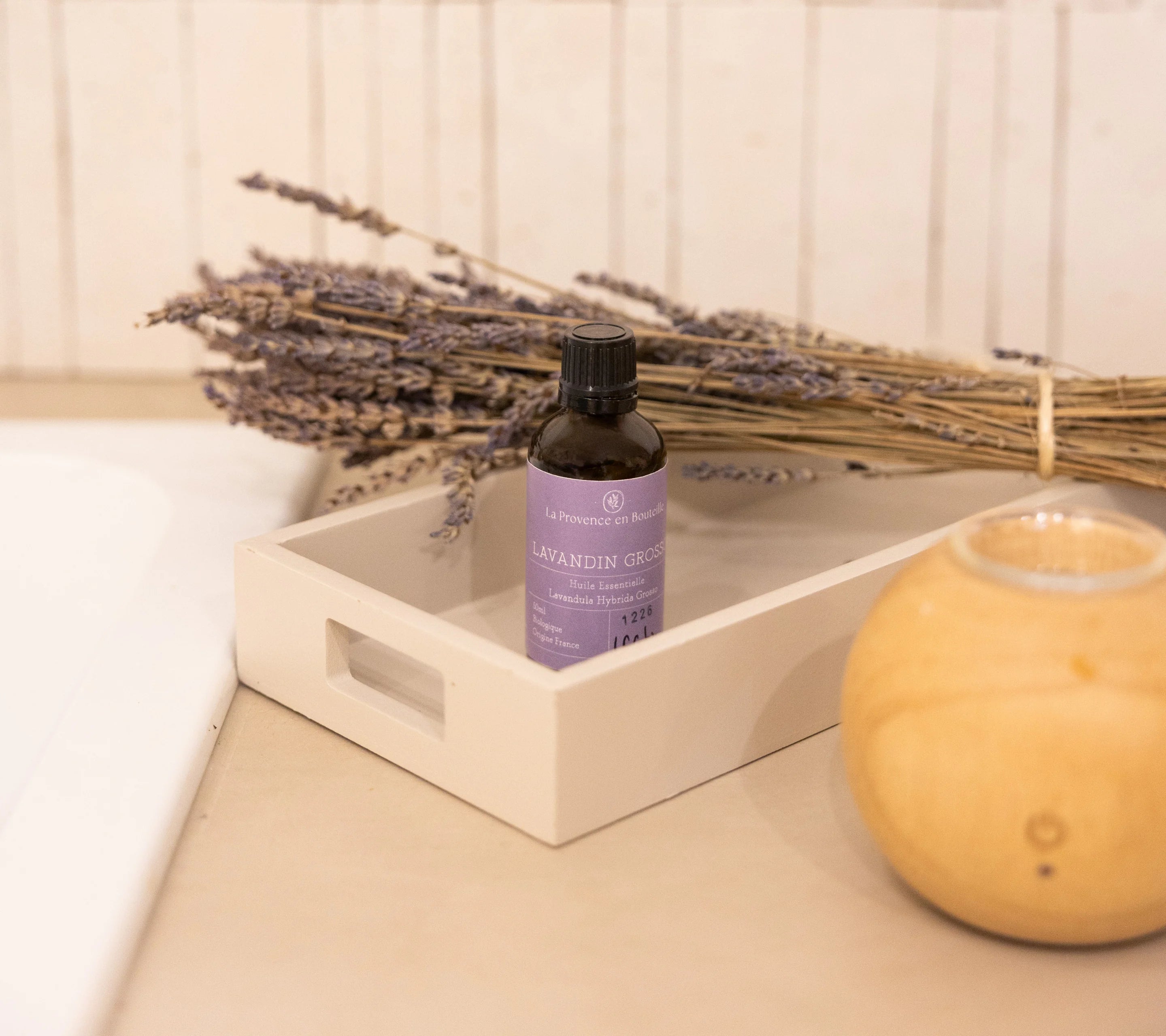 Organic Lavandin Grosso essential oil inside the Lavender Serenity Duo gift box on a white tray with dried lavender and diffuser