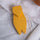 A modern handcrafted wooden cicada in yellow matte finish, made from upcycled wood in Provence by Céline en Provence.