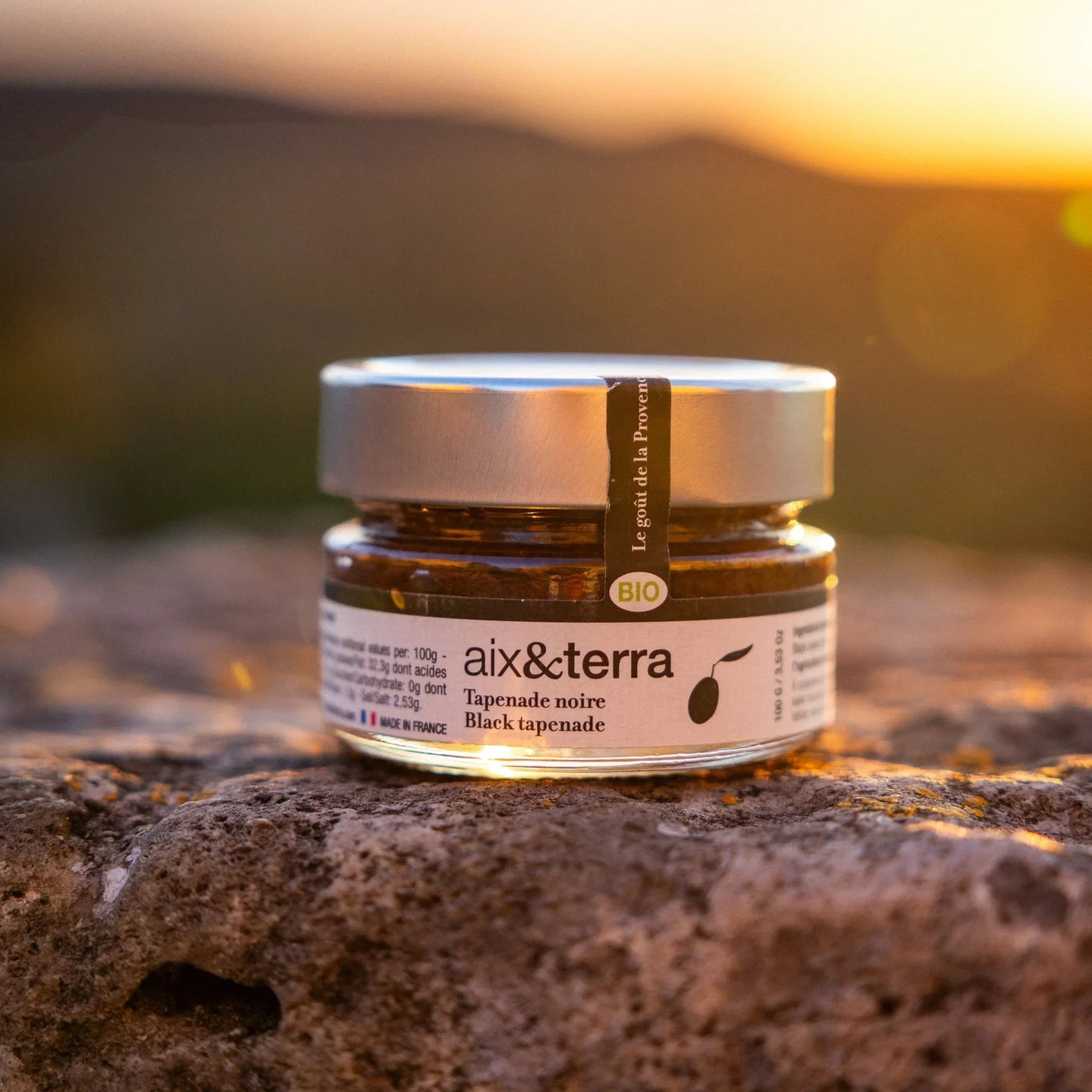 A jar of organic black tapenade from Provence, made with Tanche olives, capers, and herbs.