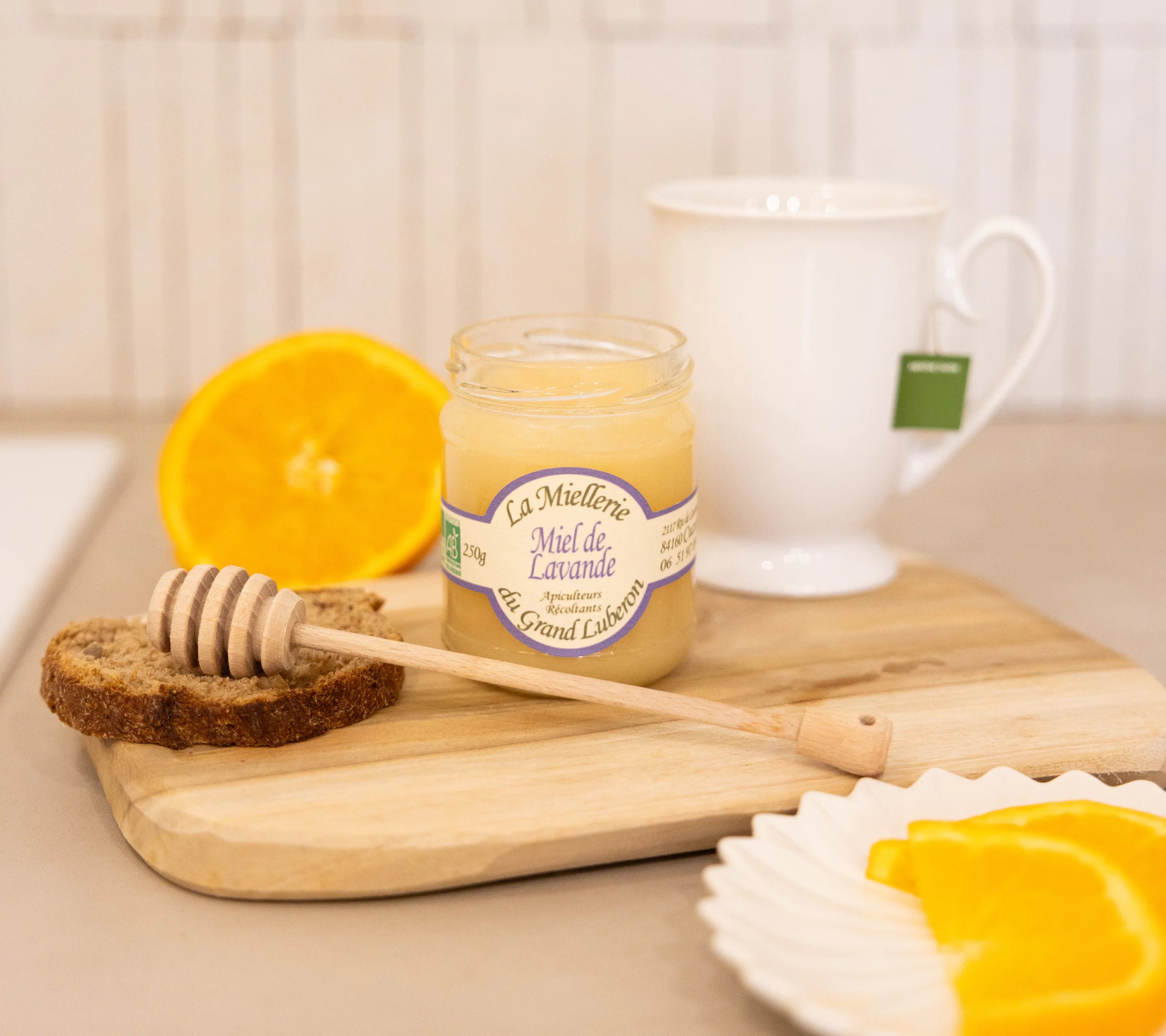 Organic lavender honey from Grand Luberon paired with bread, orange and herbal tea for a Provençal breakfast
