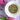 Overhead view of organic dried Provence herbs in a white bowl with pink tulips