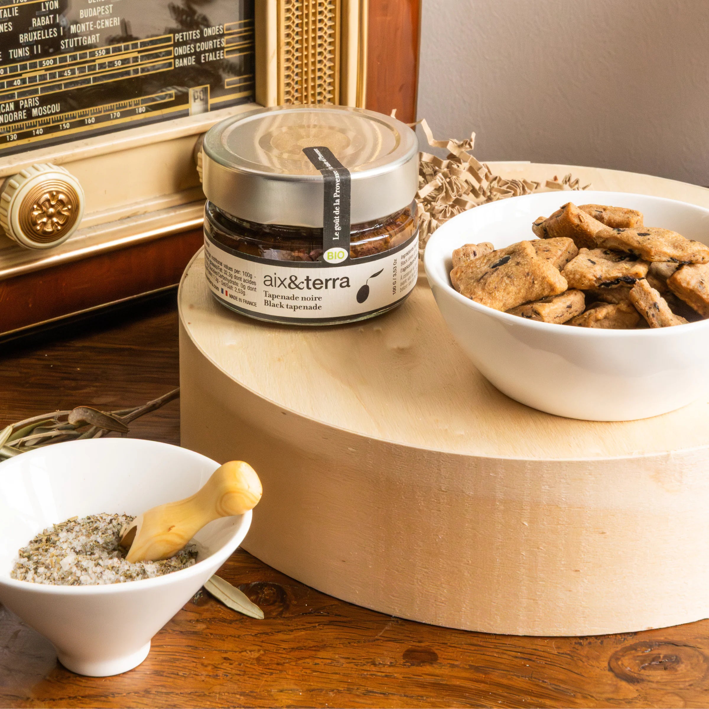 Provençal Apéro Father's Day gift box with organic black tapenade, olive herb biscuits and Fleur de Sel with wooden spoon, vintage radio decor