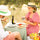 Provençal table set outdoors under olive trees with lemon olive oil, bread, colourful tomatoes and sage green tablecloth, summer in Provence