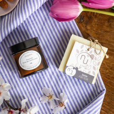 The Personal Ritual gift box with Joséphine almond scented soy candle and Nu de Sapernelle pure olive soap on Provençal striped fabric with cherry blossom and tulip