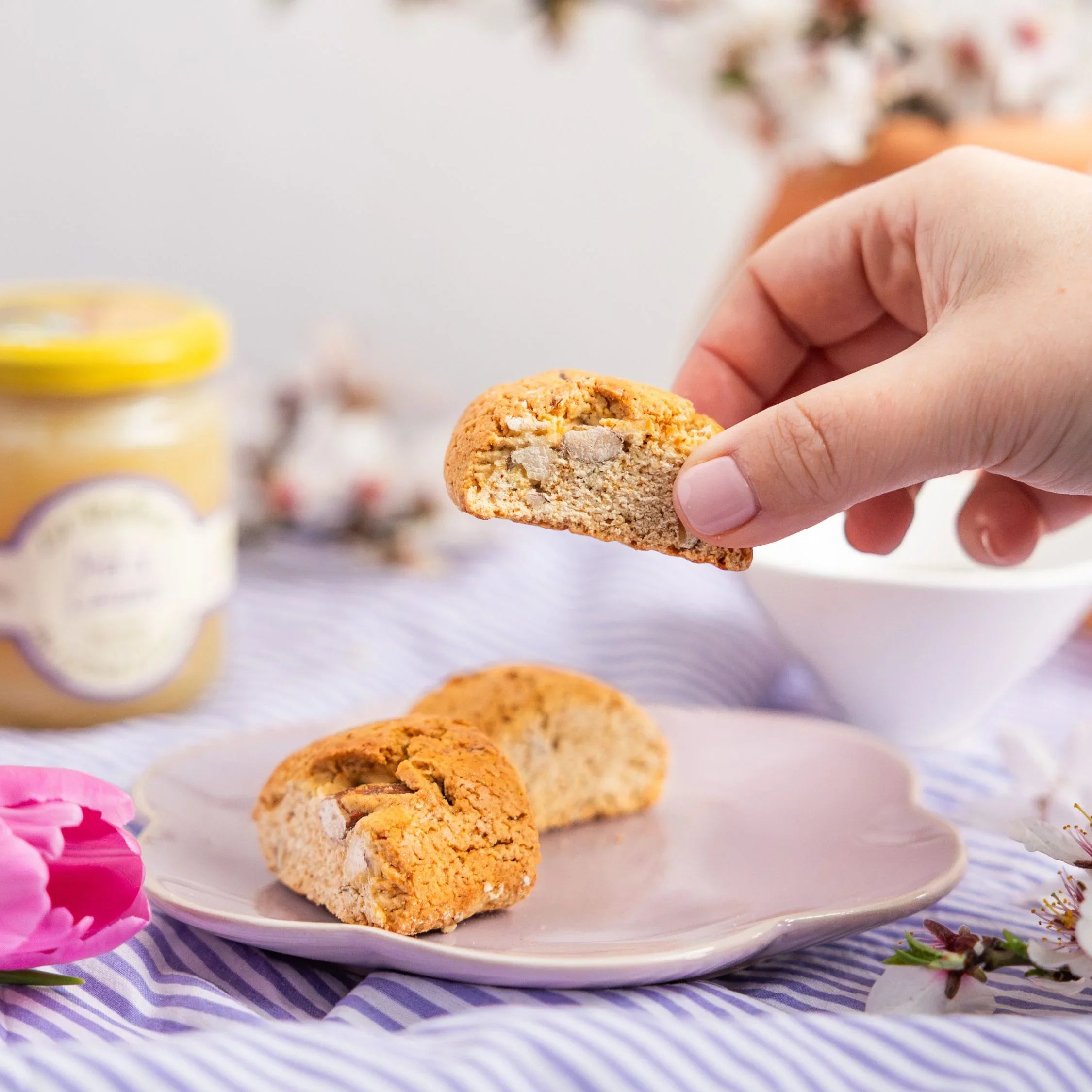 A close-up view of traditional French almonds croquants biscuits, showcasing their crunchy texture and whole roasted almonds, part of the Spring Flavours collection by Céline en Provence.