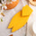 A modern handcrafted wooden cicada in yellow matte finish, made from upcycled wood in Provence by Céline en Provence.
